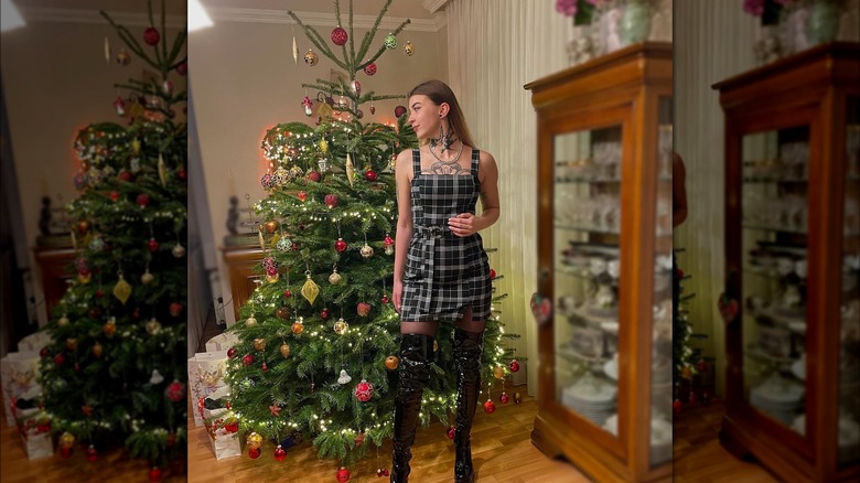 Girl wearing patent leather boots with a dress