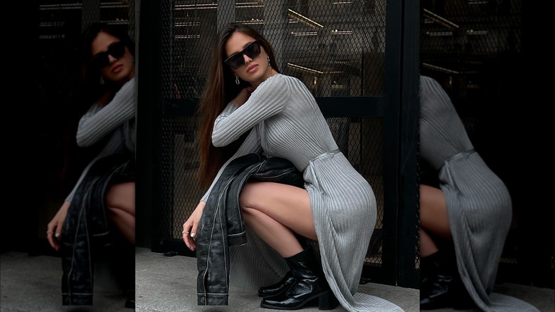Woman in gray dress and black booties