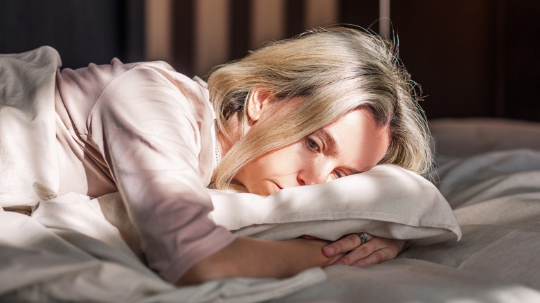 Stressed woman lying down 