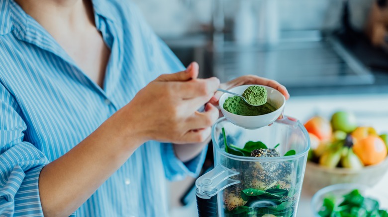 Woman making a healthy smoothie 