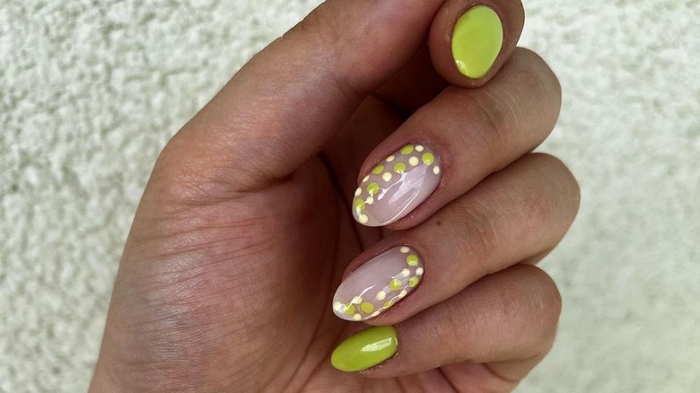 white and pea green dot nails