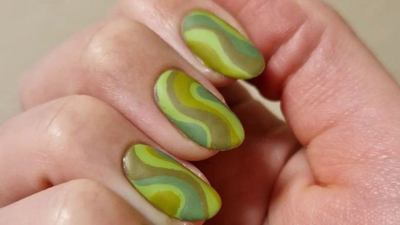 wavy green line art on nails
