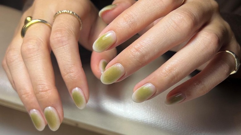 white and pea green gradient nails