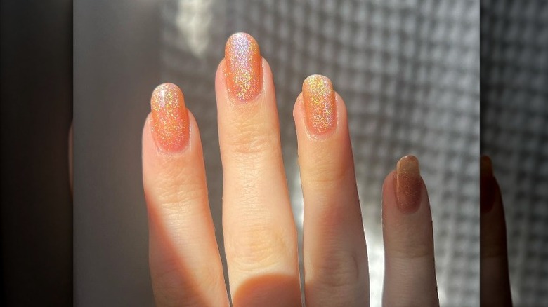 Sparkly peach orange manicure