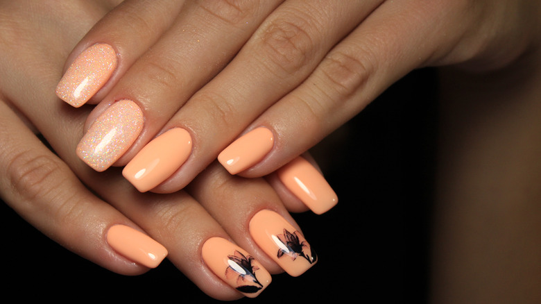 Pale orange peach nail design