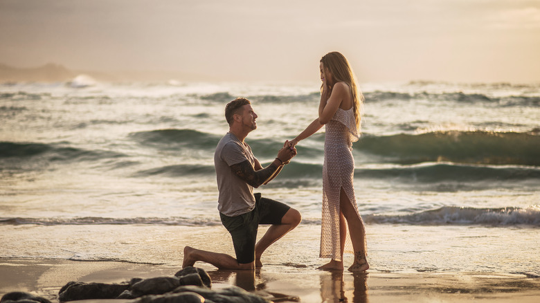 Man proposing on beach