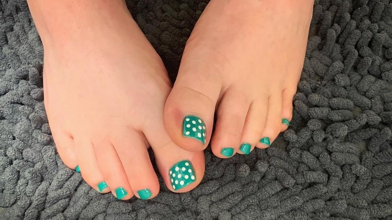 Woman with a polka-dot pedicure