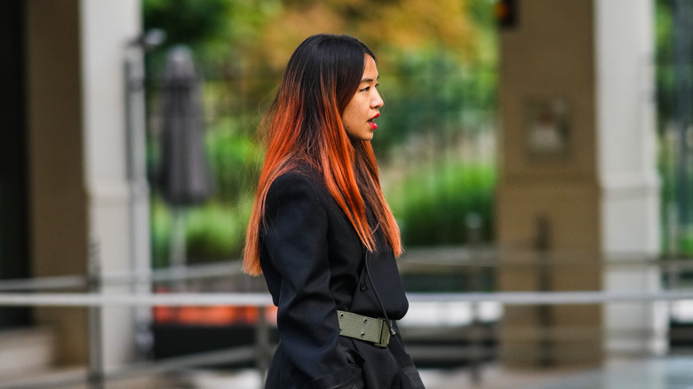 woman with black and orange dip-dyed hair