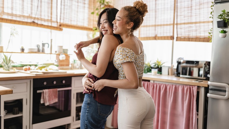 Lesbian couple in kitchen