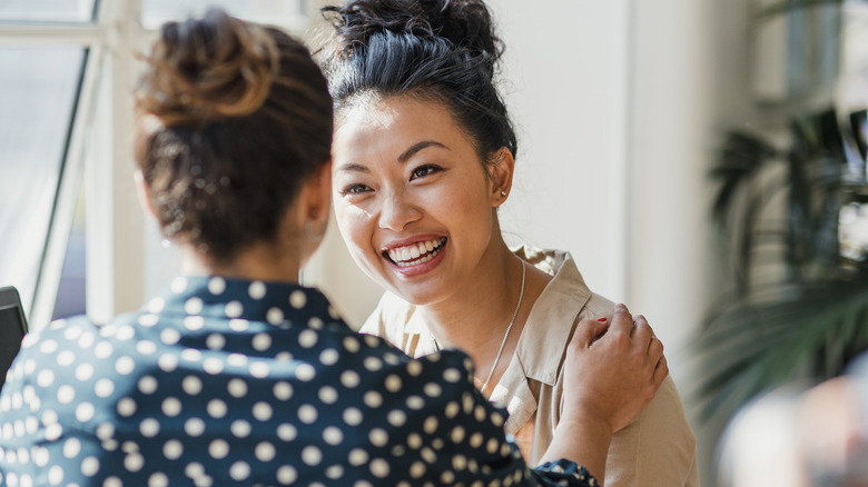 Smiling women chatting