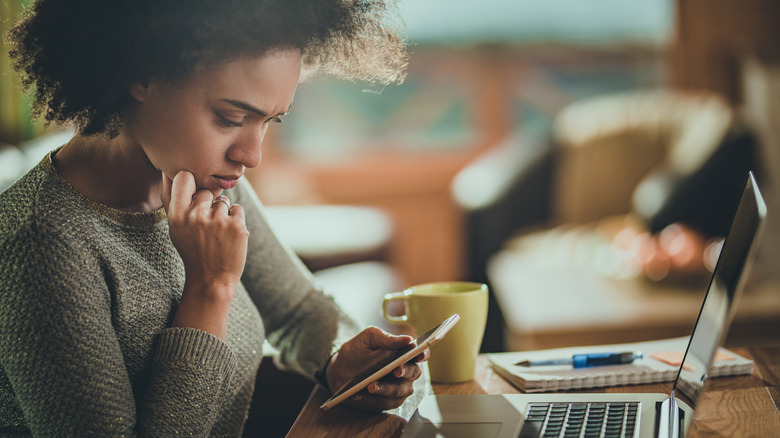 Woman on phone looking concerned