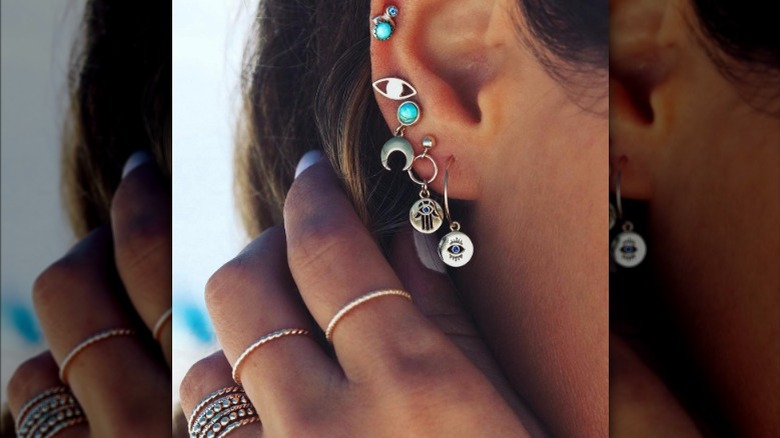 silver earrings stacked