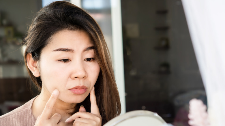 Woman looking at mouth