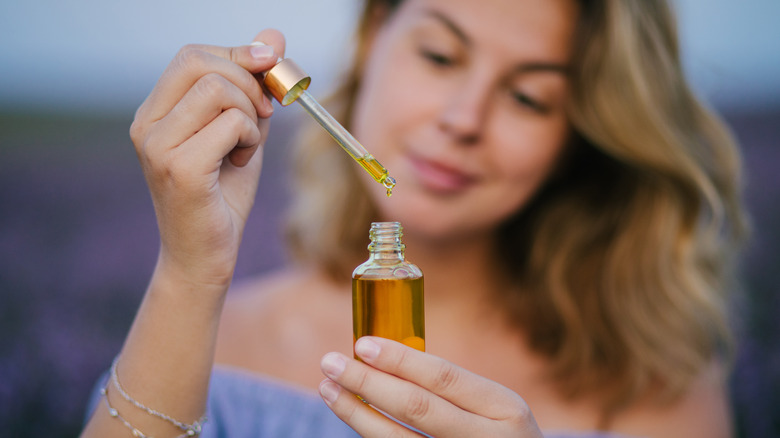 woman with aromatherapy oil