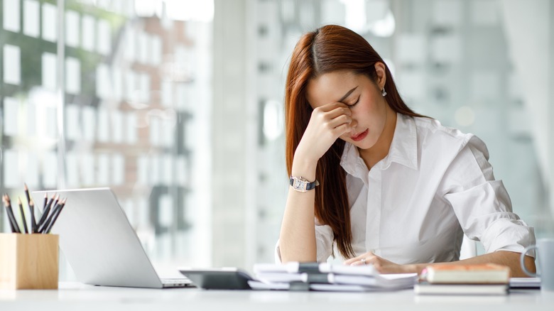 Tired employee at desk