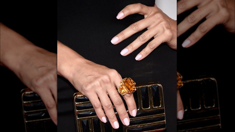 light pink nails on black dress