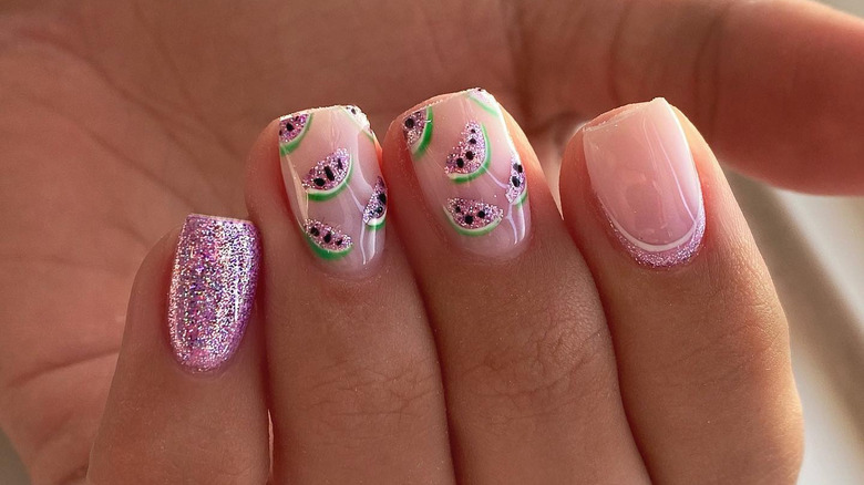 pink nails with fruit decals
