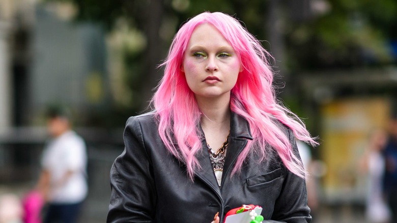 Person with pink wavy hair