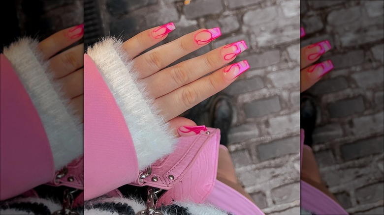 hand with pink swirl nails