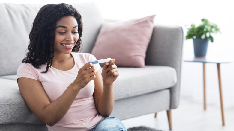 woman checking fertility test results