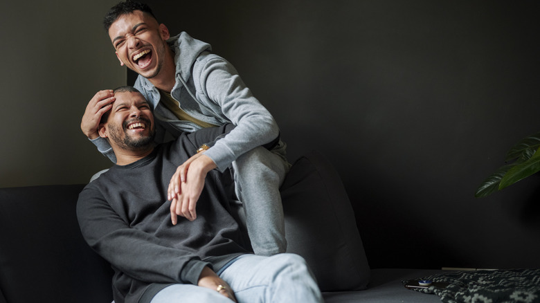 Gay couple laughing together