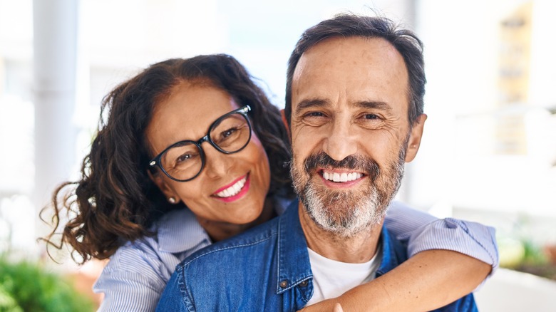 A happy couple embracing and smiling