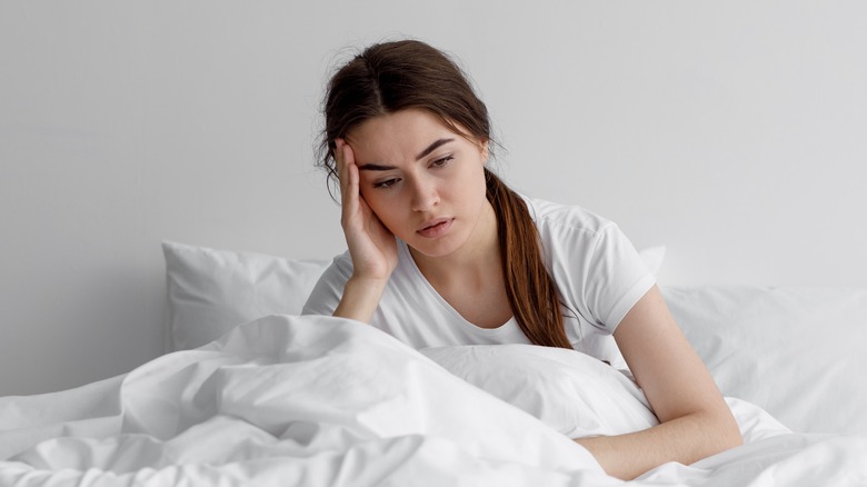 Depressed woman in bed