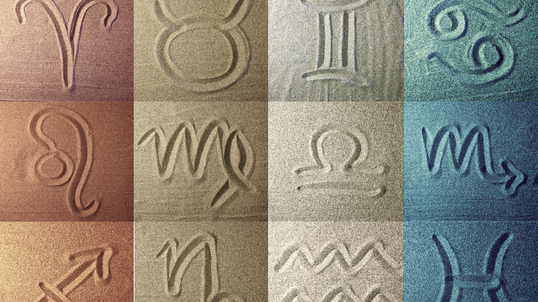 Zodiac symbols in sand