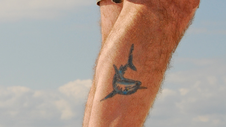 Dolphin calf tattoo