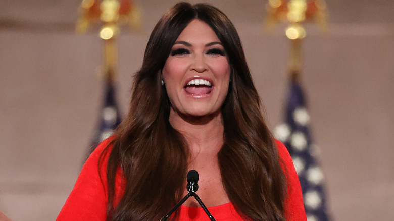 Kimberly Guilfoyle smiling in a red dress