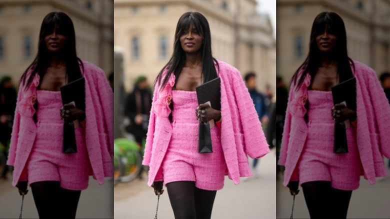 woman wearing a tweed pink playsuit and matching blazer