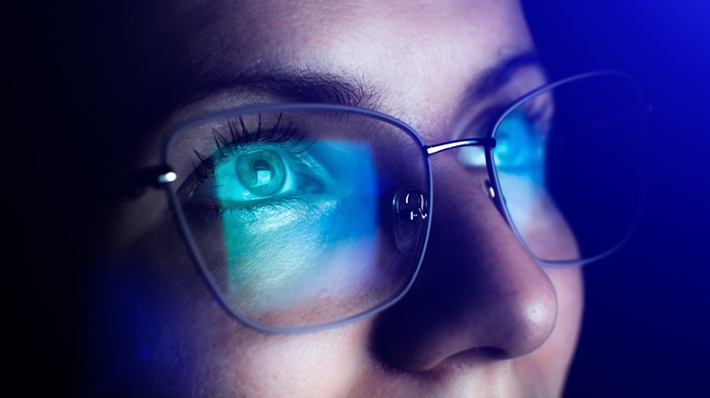 Woman wearing blue light glasses