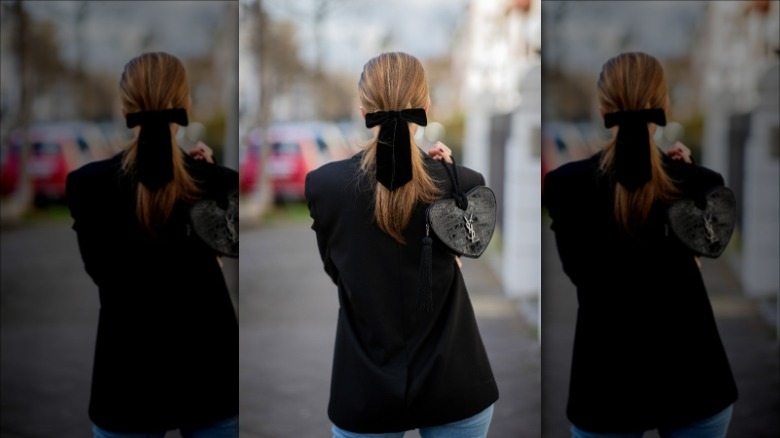 woman wearing black velvet bow