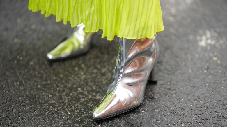 woman wearing metallic boots