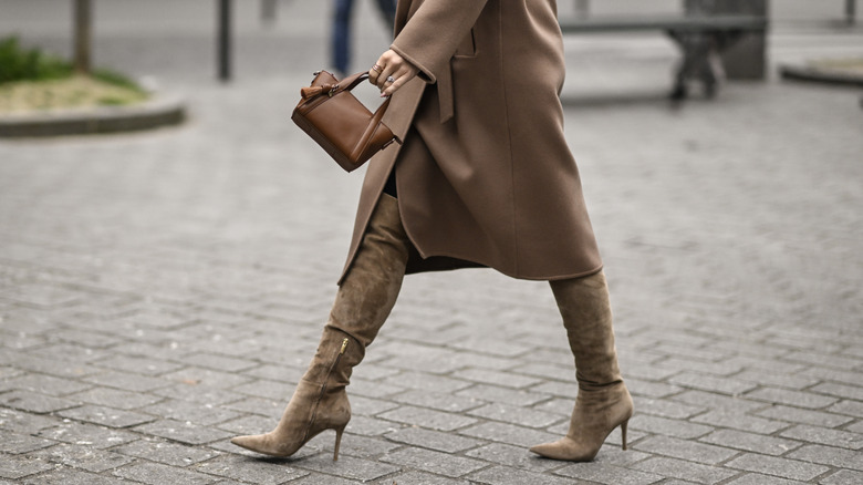 woman wearing pointed suede boots