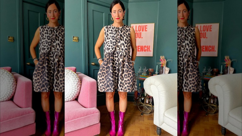 Woman wearing cheetah dress, pink boots