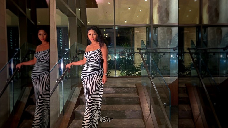 Woman wearing zebra-print slip dress