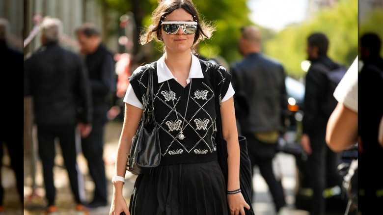 woman wearing polo top under vest