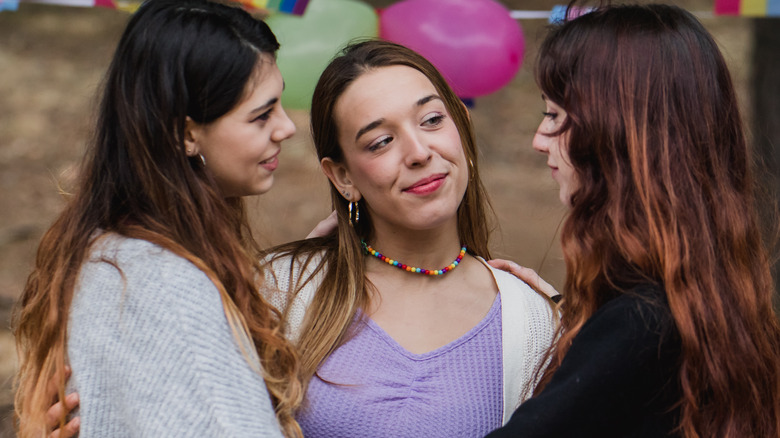 three women embracing