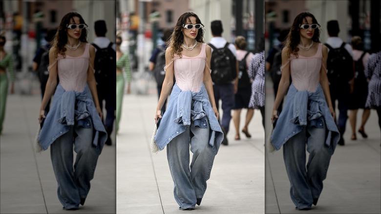 Woman wearing corset and jeans