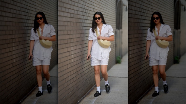 woman wearing a white poplin top and shorts