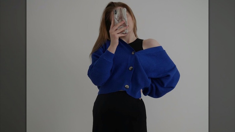 woman in blue cardigan 