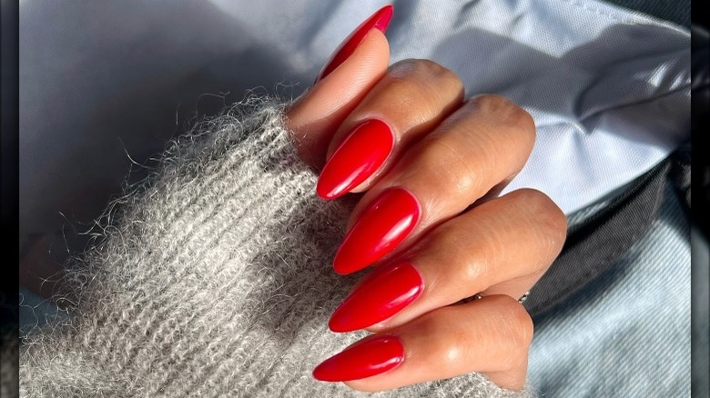 Bright red stiletto manicure nails