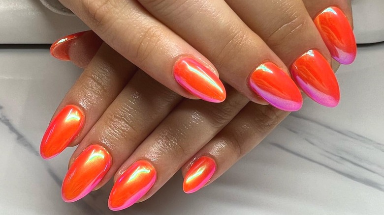 Chrome orange red almond nails