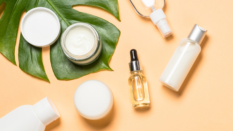 skincare products on leaf background