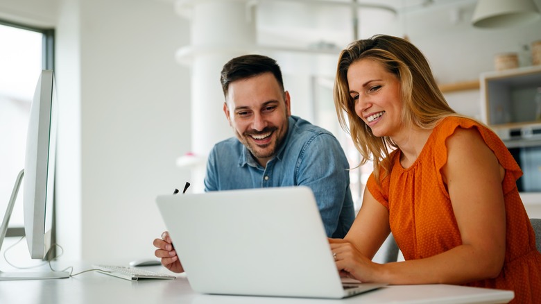 Couple looking at a laptop computer