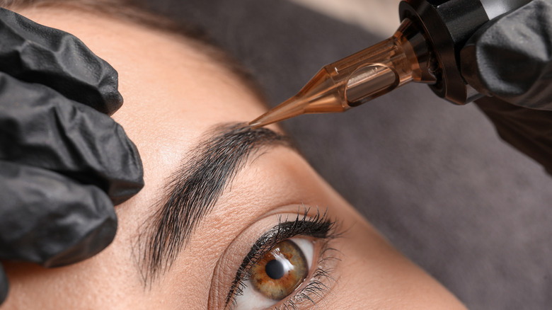 woman getting semi-permanent eyebrow