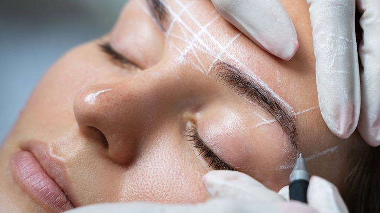 woman preparing for permanent makeup