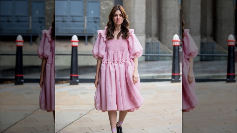 woman wearing pink prairie dress