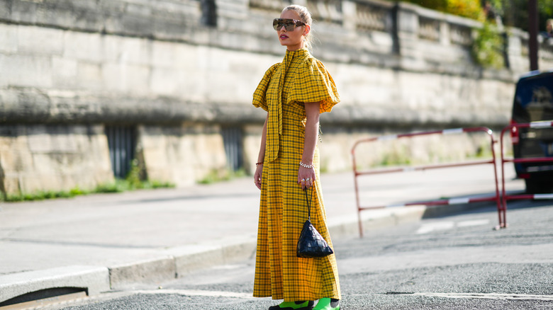 woman wearing plaid prairie dress